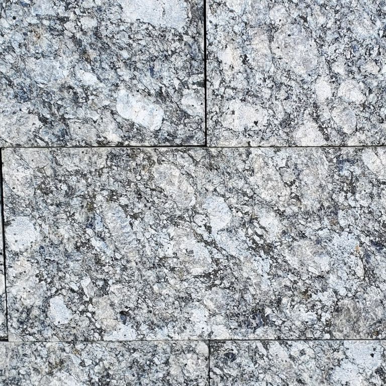 Best close-up image for Granite - Gray Leopard - Pavers. The dominant color shown is gray. The color mix creates a cool feeling.