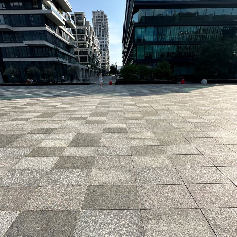 Application image for Granite - Gray Leopard. The image shows this material being used for path pavers and patio pavers. The dominant color shown is gray. The color mix creates a cool feeling.