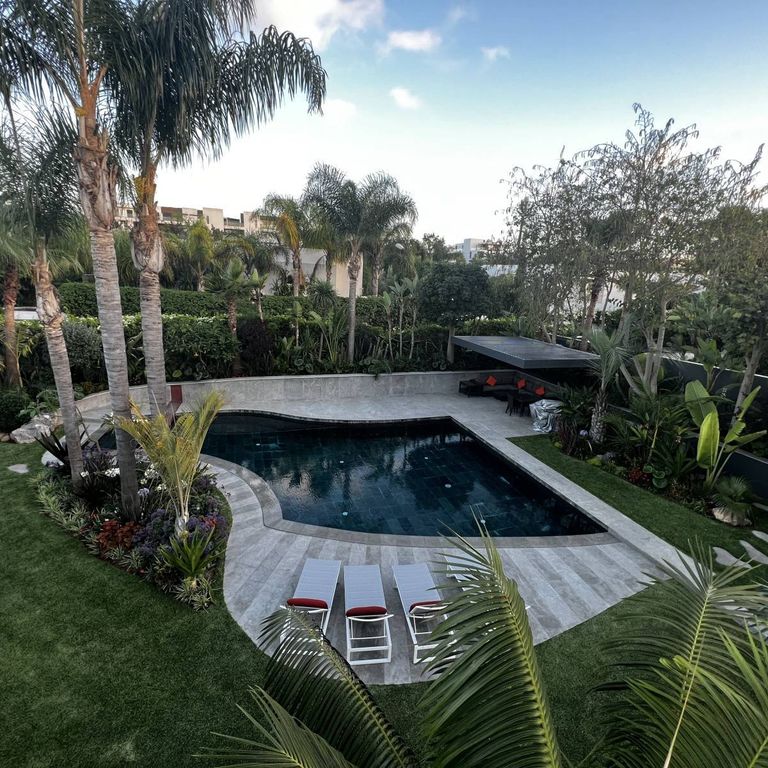 Application image for Limestone - Casablanca - Pool Coping. The image shows this product being used for pool coping and pool deck pavers. The dominant color shown is gray.