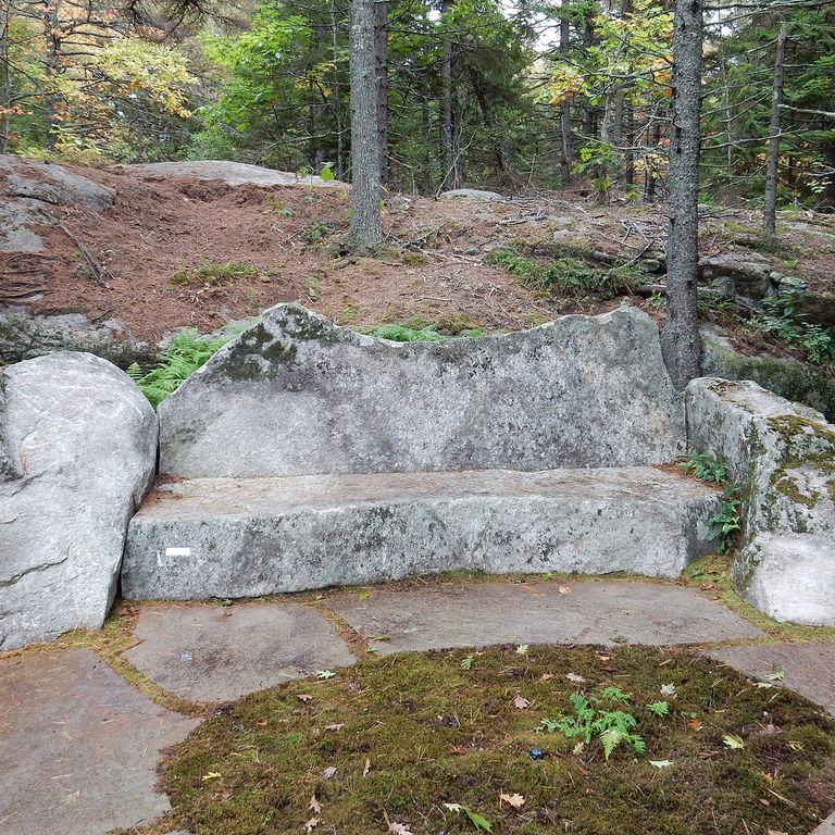 Application image for New England Fieldstone Boulders & Ledgestone - Seating & Benches. The image shows this product being used in a seating & benches application. The surface finish shown is weathered. The dominant color shown is gray. The color mix creates a warm feeling.