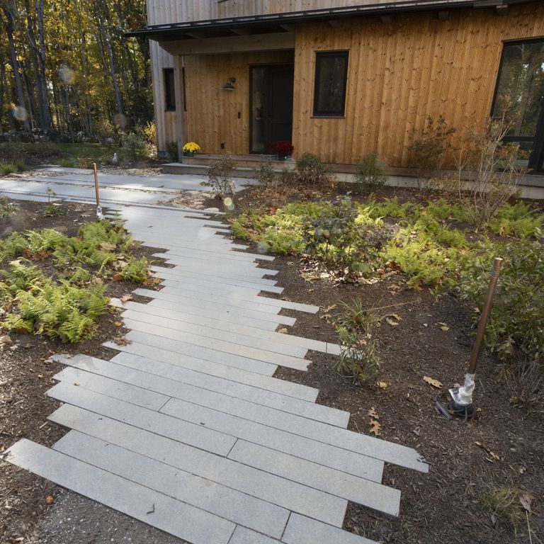 Application image for Limestone - Polar Gray - Dimensional Cut Pavers. The image shows this product being used in a path pavers application. The dominant color shown is gray. The color mix creates a cool feeling.