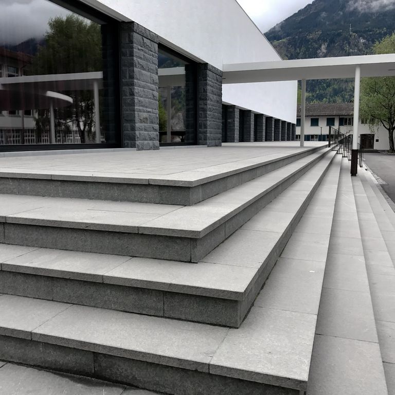 Application image for Polar Gray Limestone - Dimensional Cut Pavers. The image shows this product being used for treads and public area. The dominant color shown is gray. The color mix creates a cool feeling.