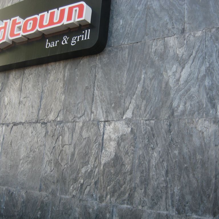 Application image for Slate - Iberian Gray - Veneer. The image shows this product being used in a thin veneer application. The dominant color shown is gray.
