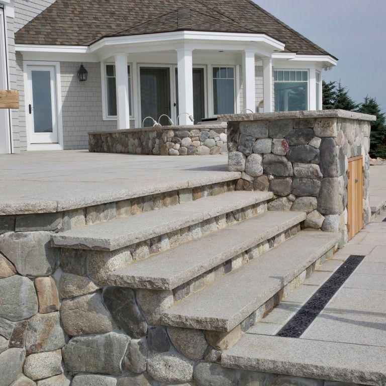 Feature image for Cape Neddick Granite Clear - Rockfaced Treads. The image shows this product being used in a treads application. The dominant color shown is gray. The color mix creates a cool feeling. Fine speckled color pattern.