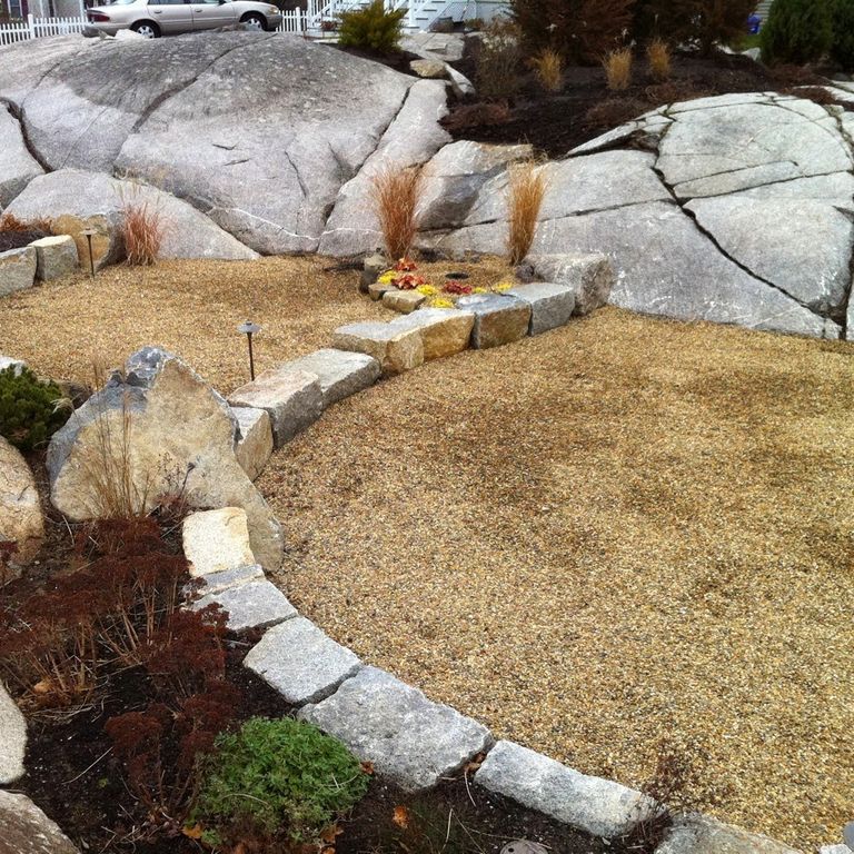 Application image for Reclaimed Granite Block - Seating Walls. The image shows this product being used for seating & benches and landscape curbing & edging. The dominant color shown is gray.
