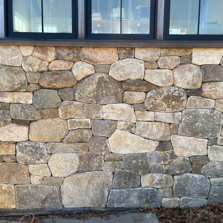 Application image for Fieldstone - New England Mix - Veneer. The image shows this product being used in a thin veneer application. The surface finish shown is weathered. The dominant color shown is gray.
