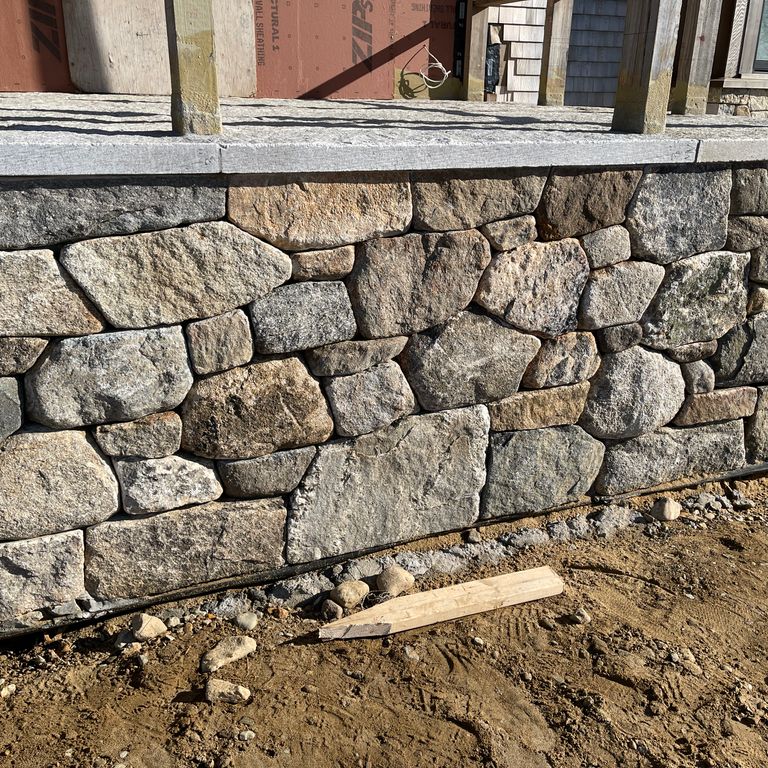 Application image for Fieldstone - New England Mix - Veneer. The image shows this product being used in a thin veneer application. The surface finish shown is weathered. Dominant colors shown are brown, gray and tan. The color mix creates a warm feeling.