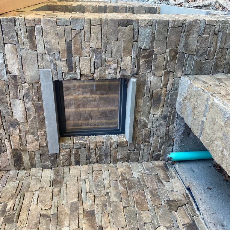 Feature image for Fieldstone - Pennsylvania - Veneer. The image shows this product being used in a thin veneer application. The surface finish shown is split-face. Dominant colors shown are gray and tan.