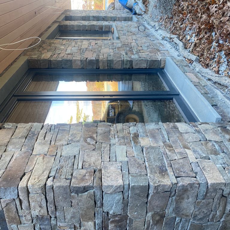 Application image for Fieldstone - Pennsylvania - Veneer. The image shows this product being used in a thin veneer application. The surface finish shown is split-face. Dominant colors shown are gray and tan.
