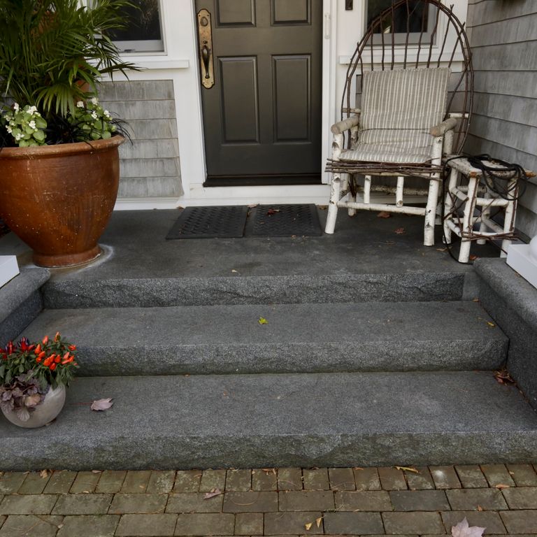 Application image for Granite - Jet Mist - Steps and Treads. The image shows this product being used in a monolithic steps application. Dominant colors shown are black and gray.
