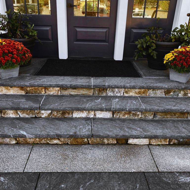 Application image for Granite - Jet Mist - Steps and Treads. The image shows this product being used in a treads application. Dominant colors shown are black and gray; with a white secondary. Exhibits 