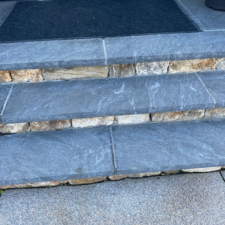 Application image for Granite - Jet Mist - Steps and Treads. The image shows this product being used in a treads application. The dominant color shown is gray. The color mix creates a cool feeling.