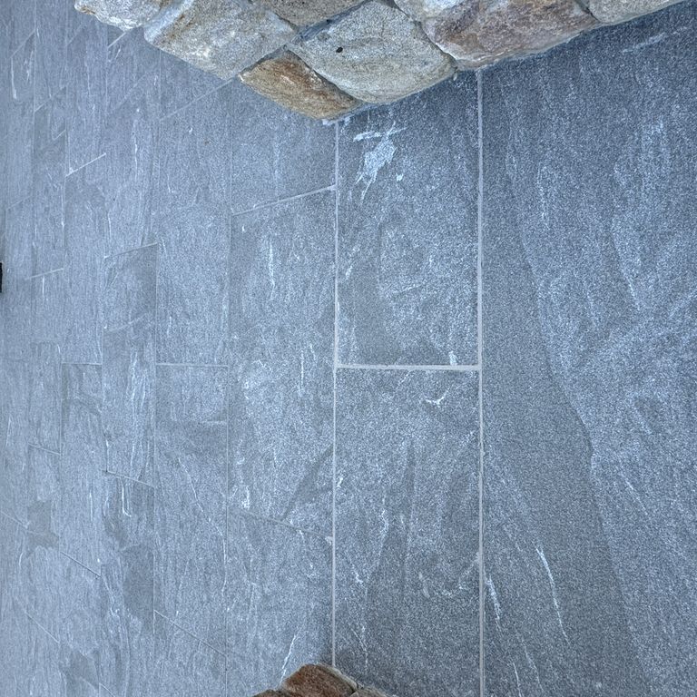 Application image for Granite - Jet Mist - Pavers. The image shows this product being used in a patio pavers application. The dominant color shown is gray. The color mix creates a cool feeling.