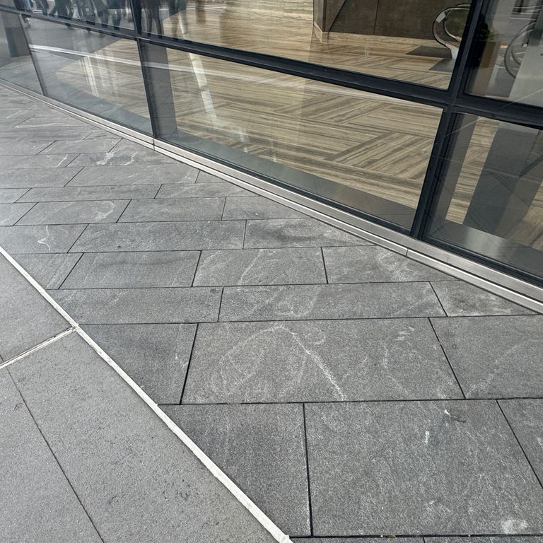 Application image for Granite - Jet Mist - Pavers. The image shows this product being used in a path pavers application. The dominant color shown is gray. The color mix creates a cool feeling.