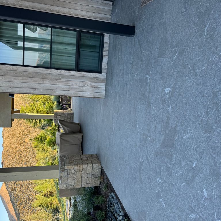 Application image for Granite - Jet Mist - Pavers. The image shows this product being used in a patio pavers application. The dominant color shown is gray.