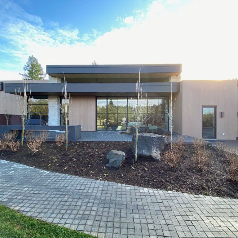 Application image for Pensy Black Granite - Flamed Cobblestones. The image shows this product being used in a driveway pavers application. The dominant color shown is gray. The color mix creates a cool feeling.