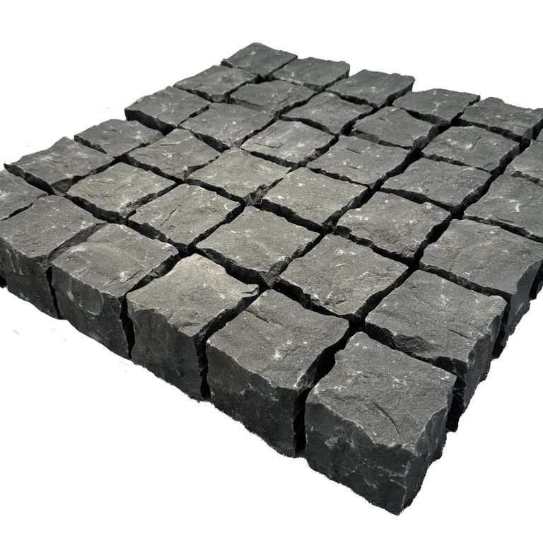 Application image for Nordic Black Basalt Cobblestones - Cubes - Split Top, Split Sides. The surface finish shown is split-face. Dominant colors shown are black and gray. The color mix creates a cool feeling.
