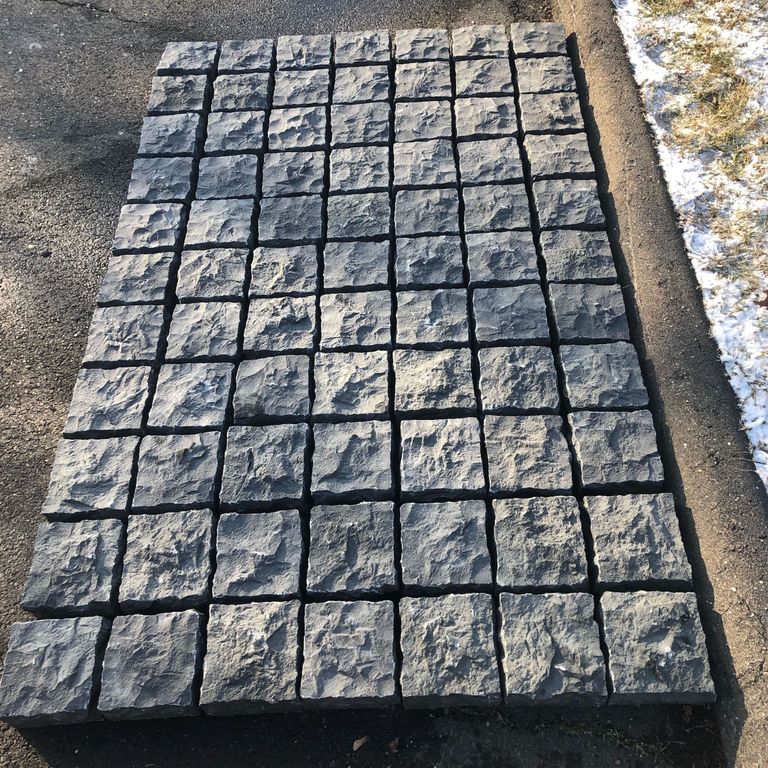 Application image for Nordic Black Basalt Cobblestones - Cubes - Split Top, Split Sides. The surface finish shown is split-face. Dominant colors shown are black and gray. The color mix creates a cool feeling. Solid color pattern.