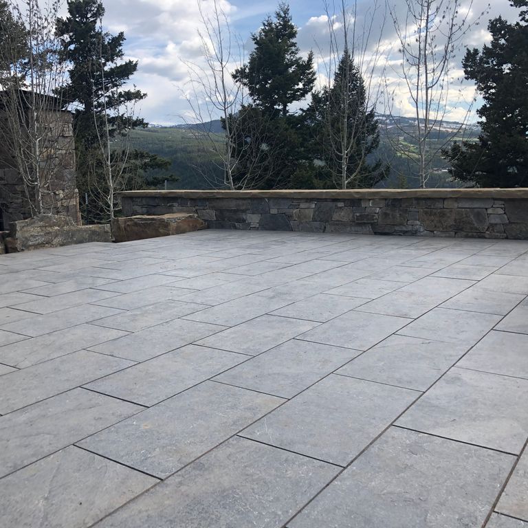 The image shows this product being used in a patio pavers application.