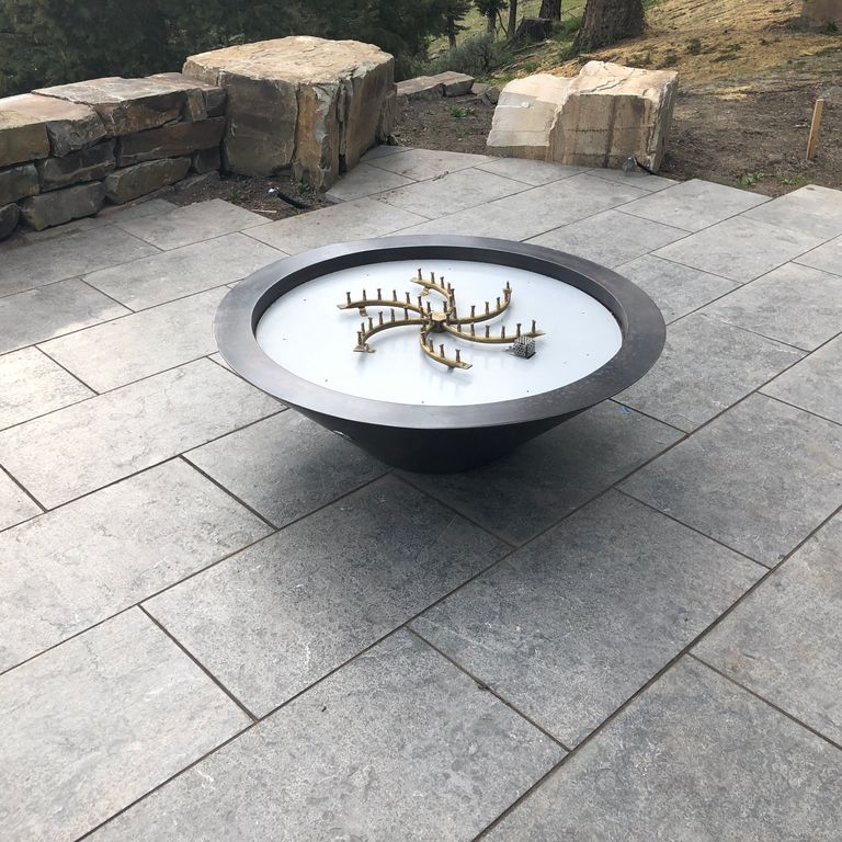 The image shows this product being used in a patio pavers application.