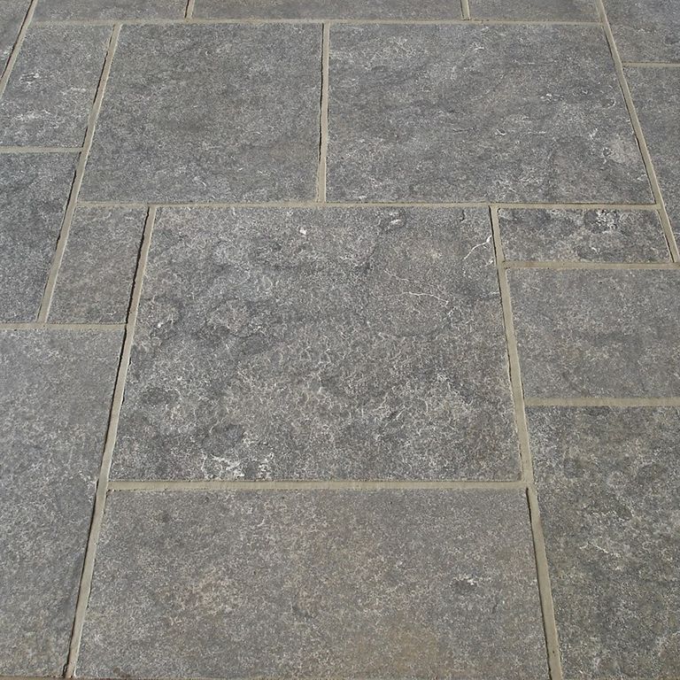 Application image for Highland Limestone - Flamed Pavers. The image shows this product being used in a patio pavers application. The dominant color shown is gray. The color mix creates a cool feeling.
