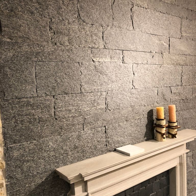 Application image for Brazilian Lucerna Gneiss - Interior Wall Cladding. The image shows this product being used in an interior cladding application. The surface finish shown is split-face. The dominant color shown is gray. The color mix creates a warm feeling.