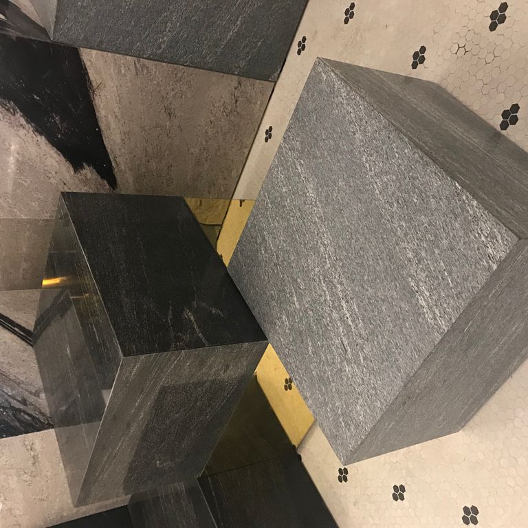 Application image for Brazilian Lucerna Gneiss - Benches. The image shows this product being used in a seating & benches application. The surface finish shown is flamed. The dominant color shown is gray. The color mix creates a warm feeling.