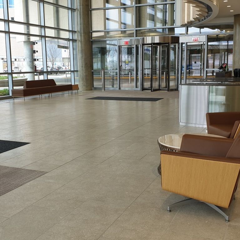 Application image for Veneto Olivo Limestone - Interior Flooring. The image shows this product being used in an interior floor application. The surface finish shown is . Dominant colors shown are gray and tan.