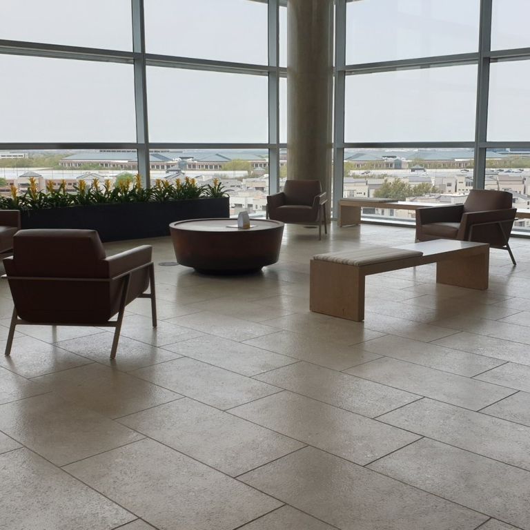 Application image for Veneto Olivo Limestone - Interior Flooring. The image shows this product being used in an interior floor application. The surface finish shown is . Dominant colors shown are gray and tan. The color mix creates a warm feeling.