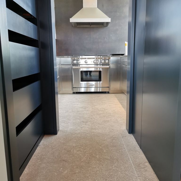 Application image for Veneto Olivo Limestone - Interior Flooring. The image shows this product being used in an interior floor application. The surface finish shown is . The dominant color shown is beige. The color mix creates a warm feeling.