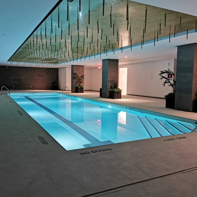 Application image for Veneto Olivo Limestone - Pool Coping. The image shows this product being used for pool coping and pool deck pavers. Dominant colors shown are beige and gray. The color mix creates a cool feeling.